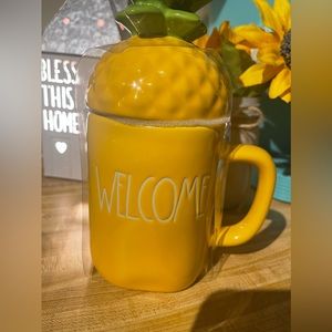 Rae Dunn mug with topper.